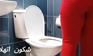 Moroccan Woman Cleaning Toilet