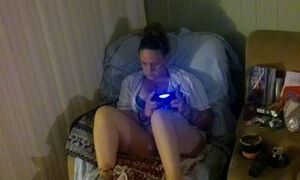 Step mom smoking cigarette and playing video games in her bra and panties (Part 2)